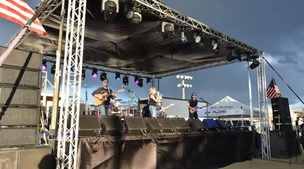 Band playing on an outdoor festival stage