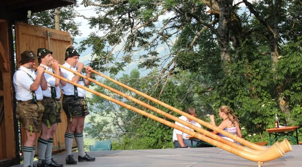 Alphorn players performing outdoors