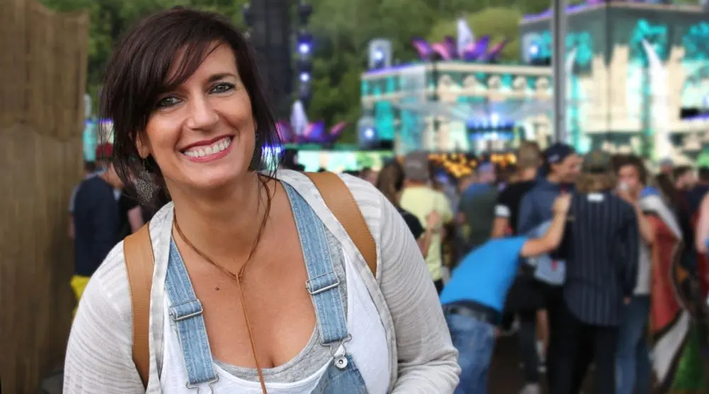 Smiling woman in a festival crowd