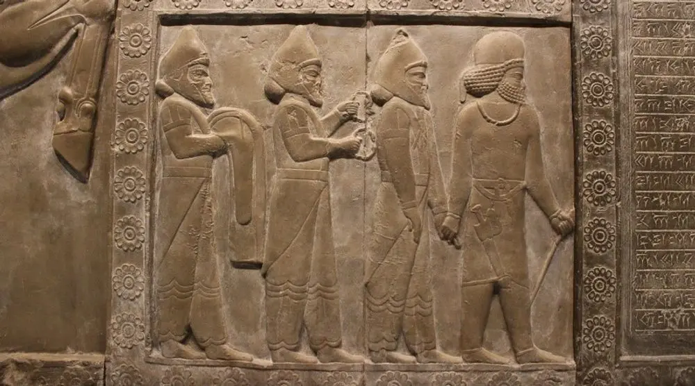 Ancient Assyrian stone relief of figures