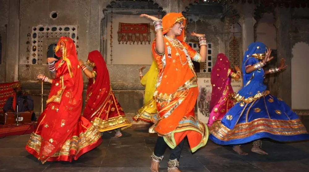 Women in bright skirts performing a folk dance