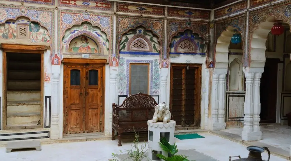 Painted haveli doors and frescoed walls