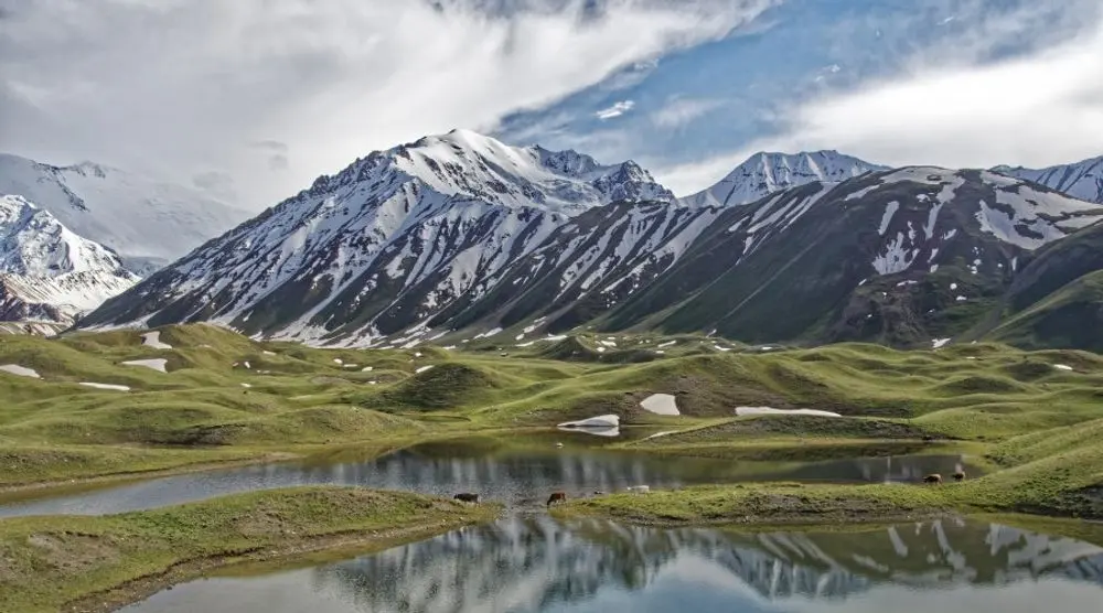 Snow-capped peaks above a lake in Kyrgyzstan