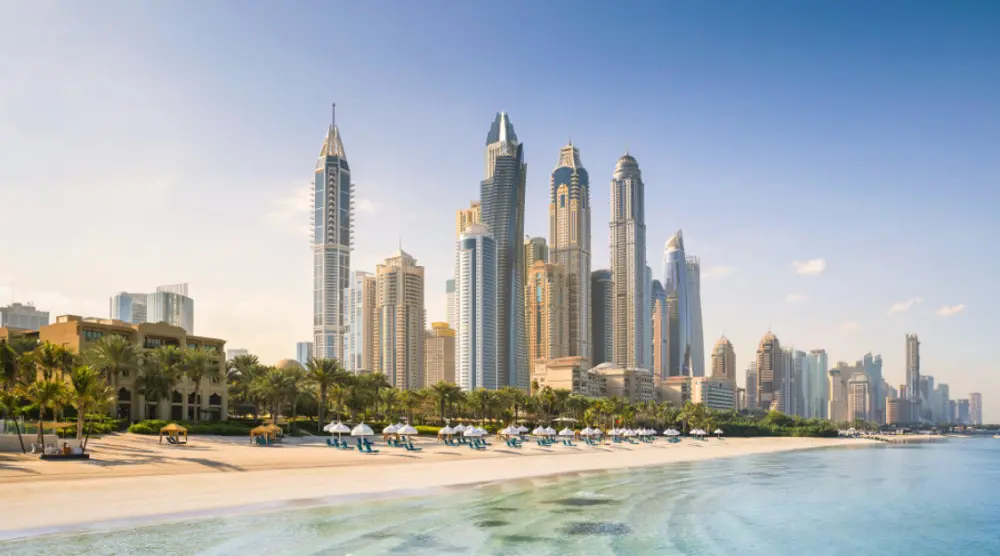 Dubai Marina towers above a sandy beach