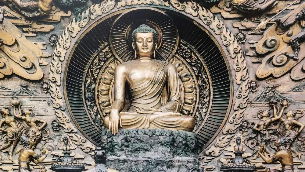 Gilded Buddha relief in a carved halo