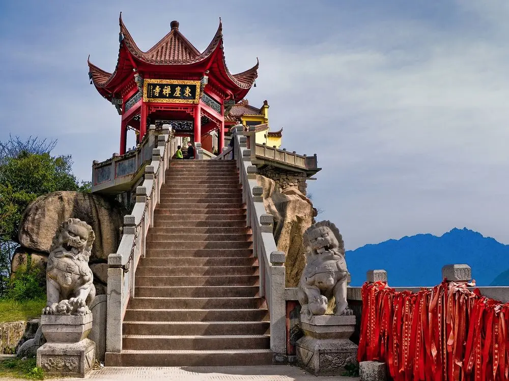 Steps up to a red pagoda gate