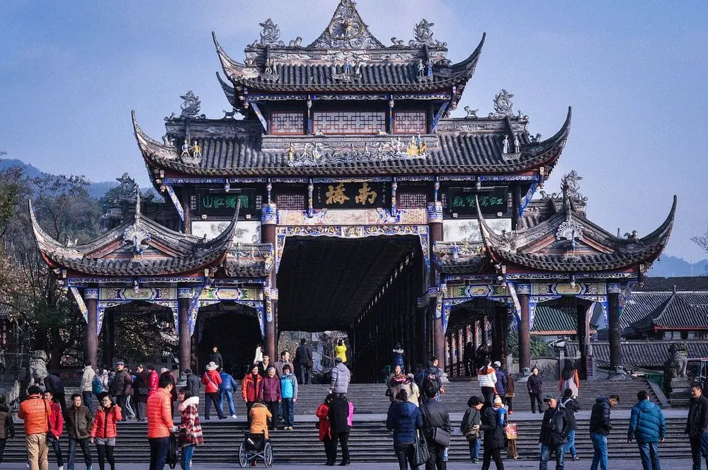 Ornate Chinese temple gateway with visitors