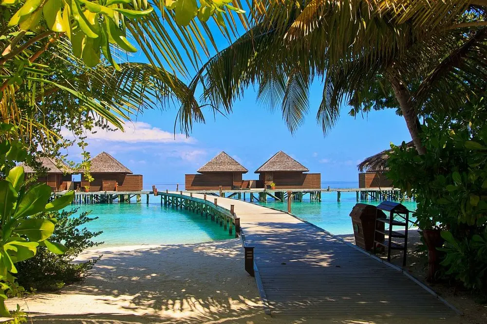 Wooden jetty leading to overwater villas in the Maldives