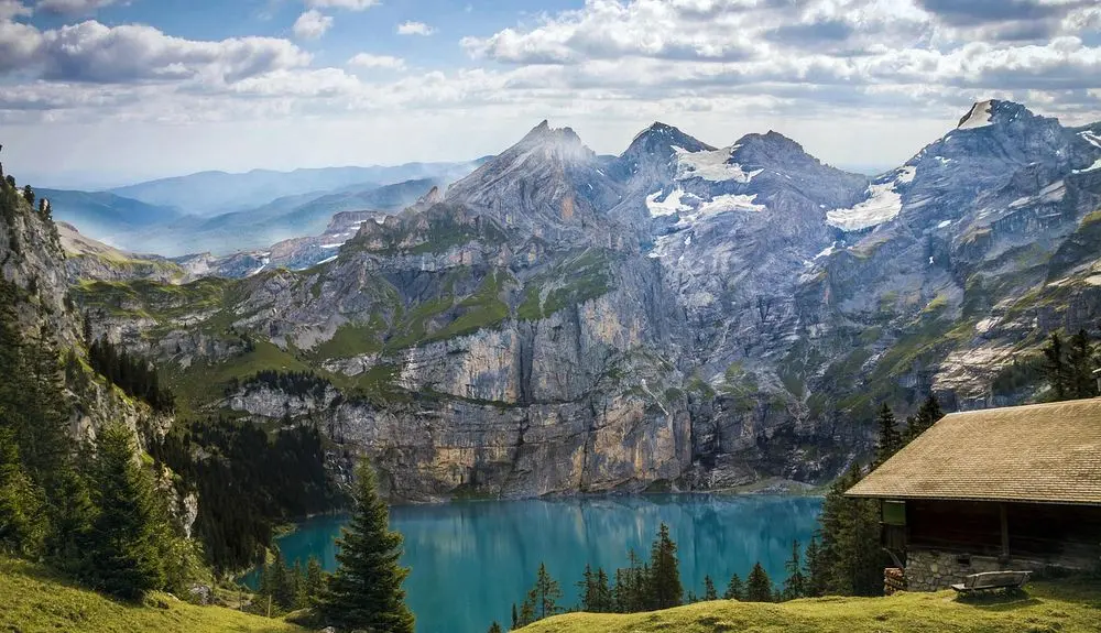 Turquoise Oeschinen Lake below Swiss peaks