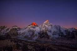 Everest summit lit red at dusk