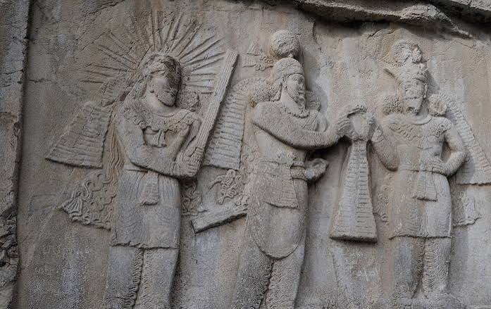 Ancient Persian rock relief of royal figures