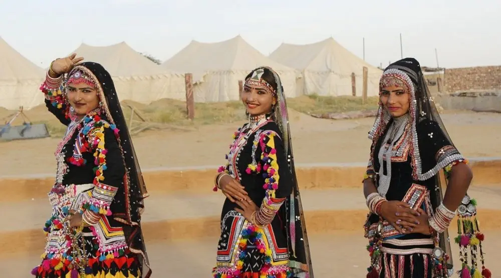 Rajasthani women in mirrored folk dress