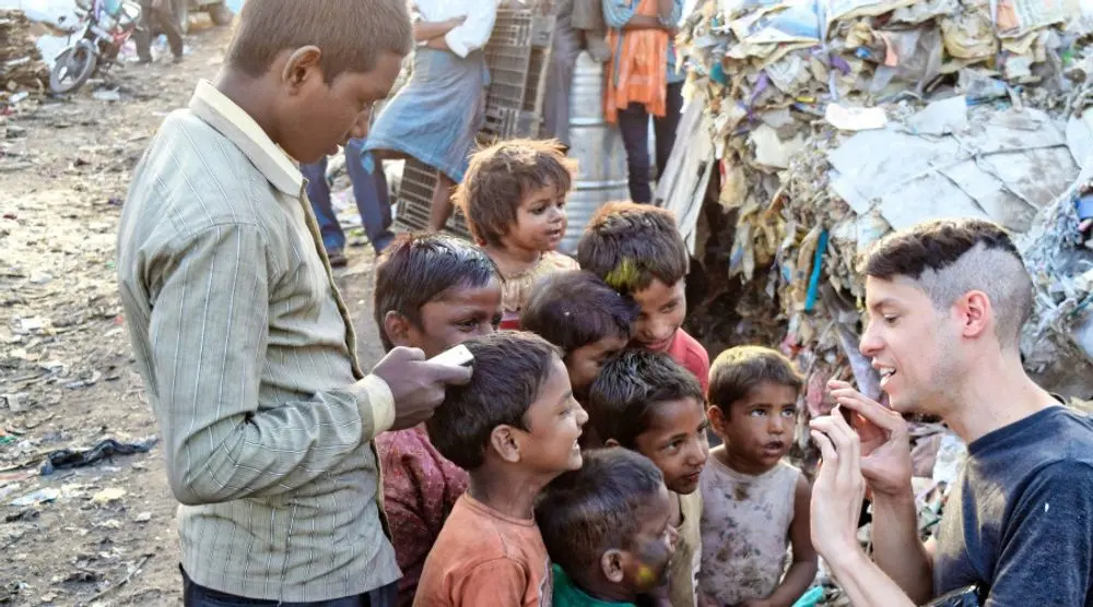 Volunteer playing with children in a slum