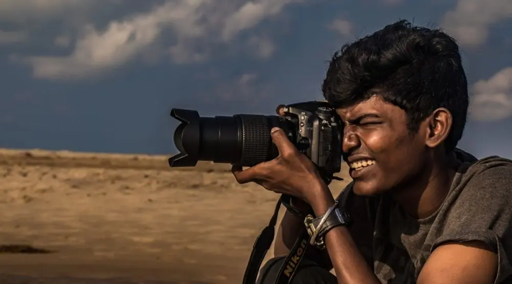 Photographer taking a picture outdoors