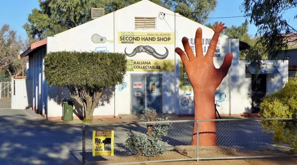 Second-hand shop with a giant hand sculpture