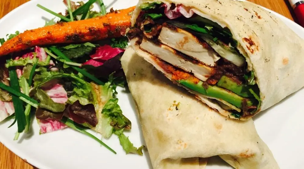Vegetable wrap and salad on a plate