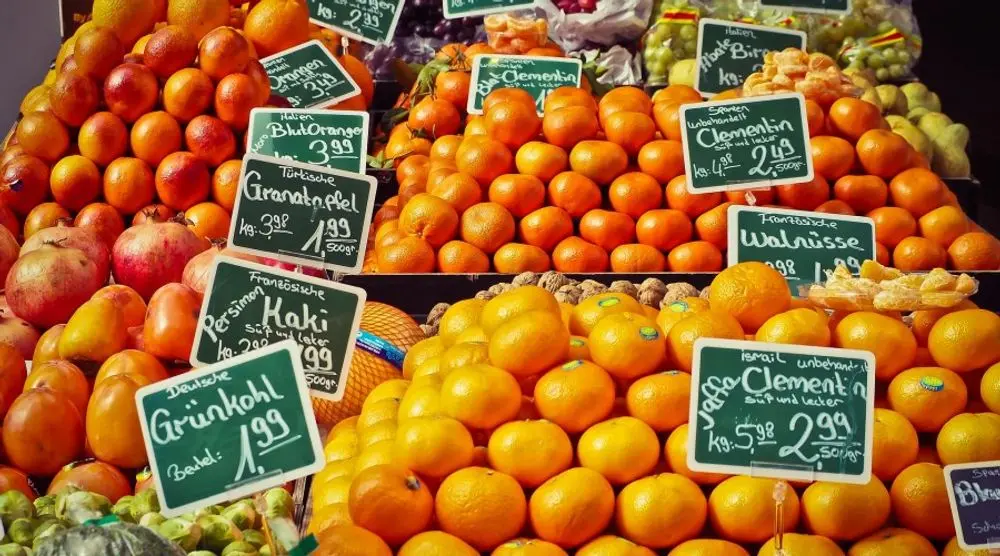 Oranges and fruit with price tags at a market