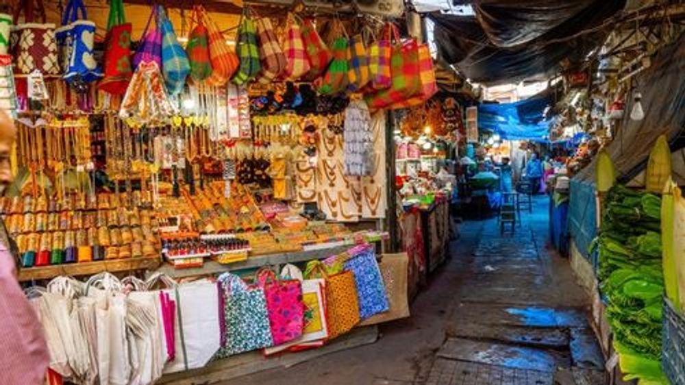 Colourful goods in a narrow market lane