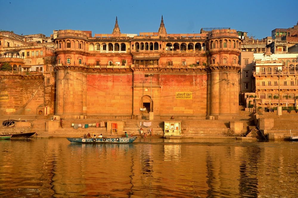 Riverside palace and ghats at sunset